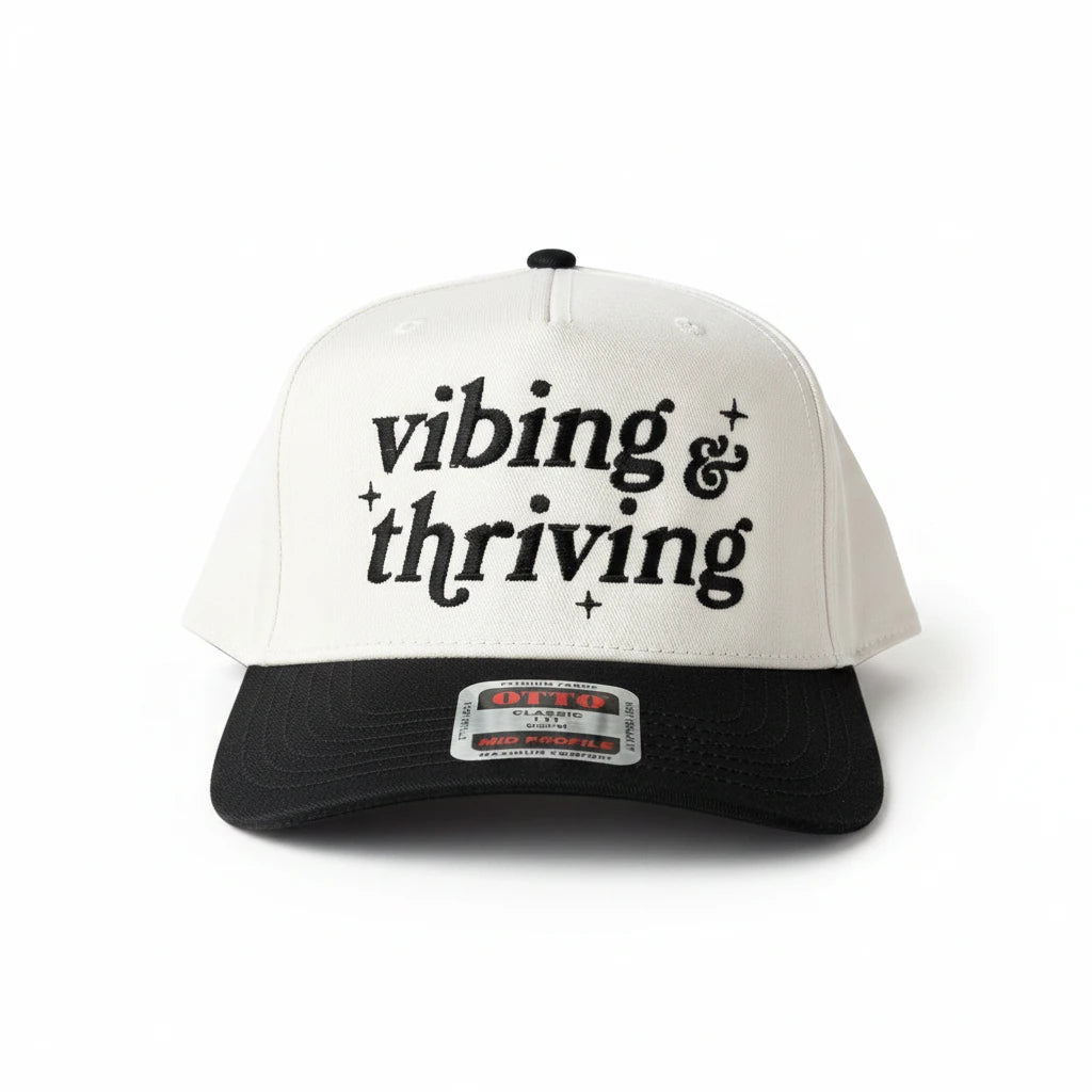 vibing and thriving Trucker Hat